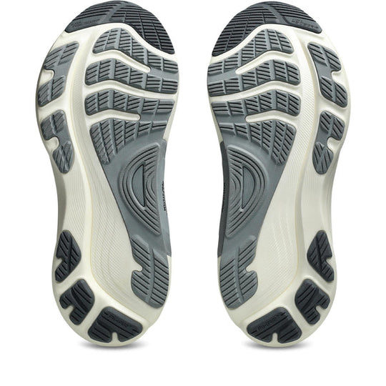 Close-up of a pair of Gel-Kayano 32 shoes with textured soles on a white background.