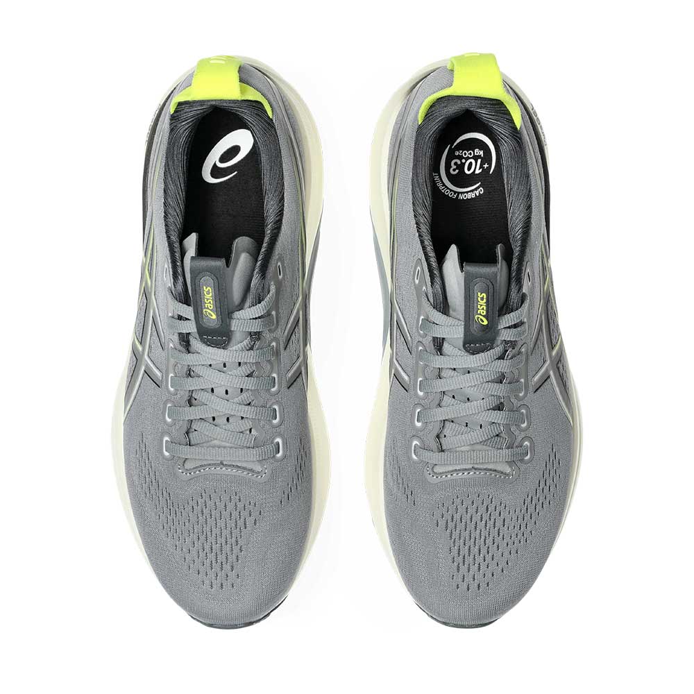A pair of ASICS Gel-Kayano 32 running shoes in gray with bright neon yellow accents on the tongue pull tabs and heel collar, shown from a top-down view on a white background.