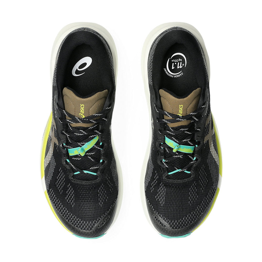 A pair of ASICS Trabuco 14 running shoes shown from a top-down view against a white background. The shoes feature a black and gray textured mesh upper, a brown collar, a white midsole, and accents of neon yellow-green and teal on the laces and outsole.