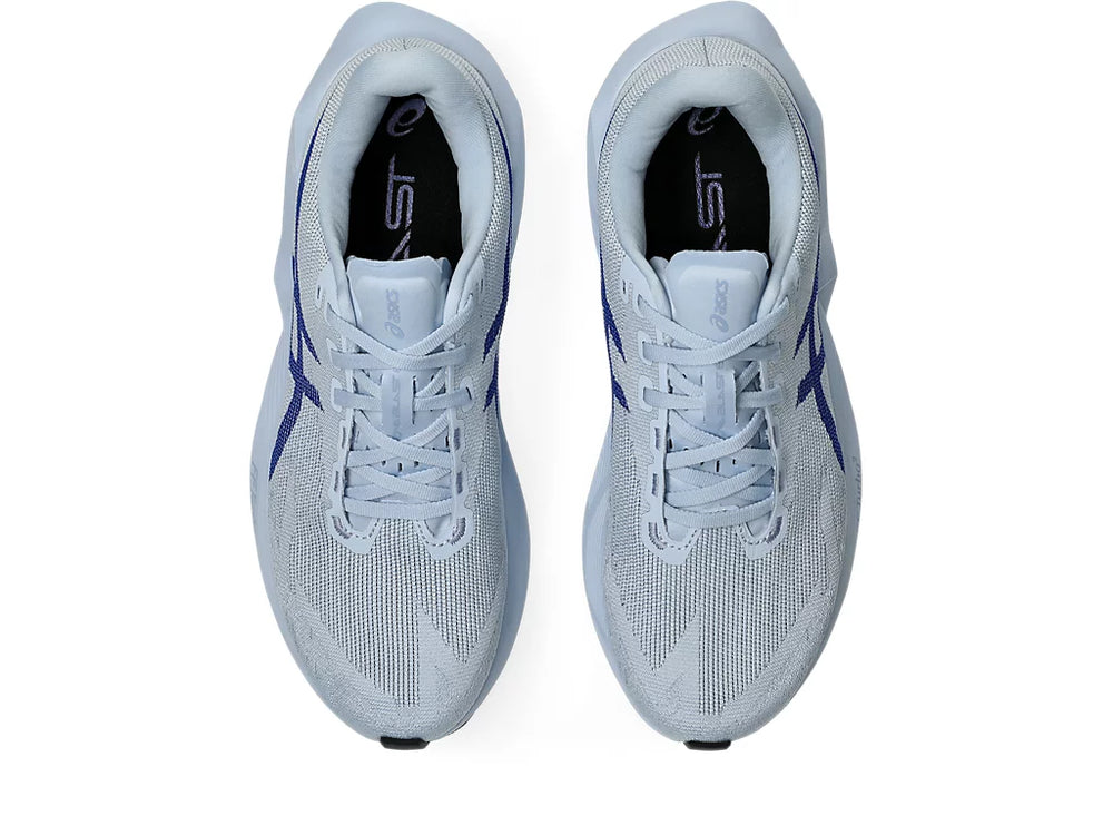 Novablast 6 a men's pair of light blue running shoes with a brand logo on a white background.