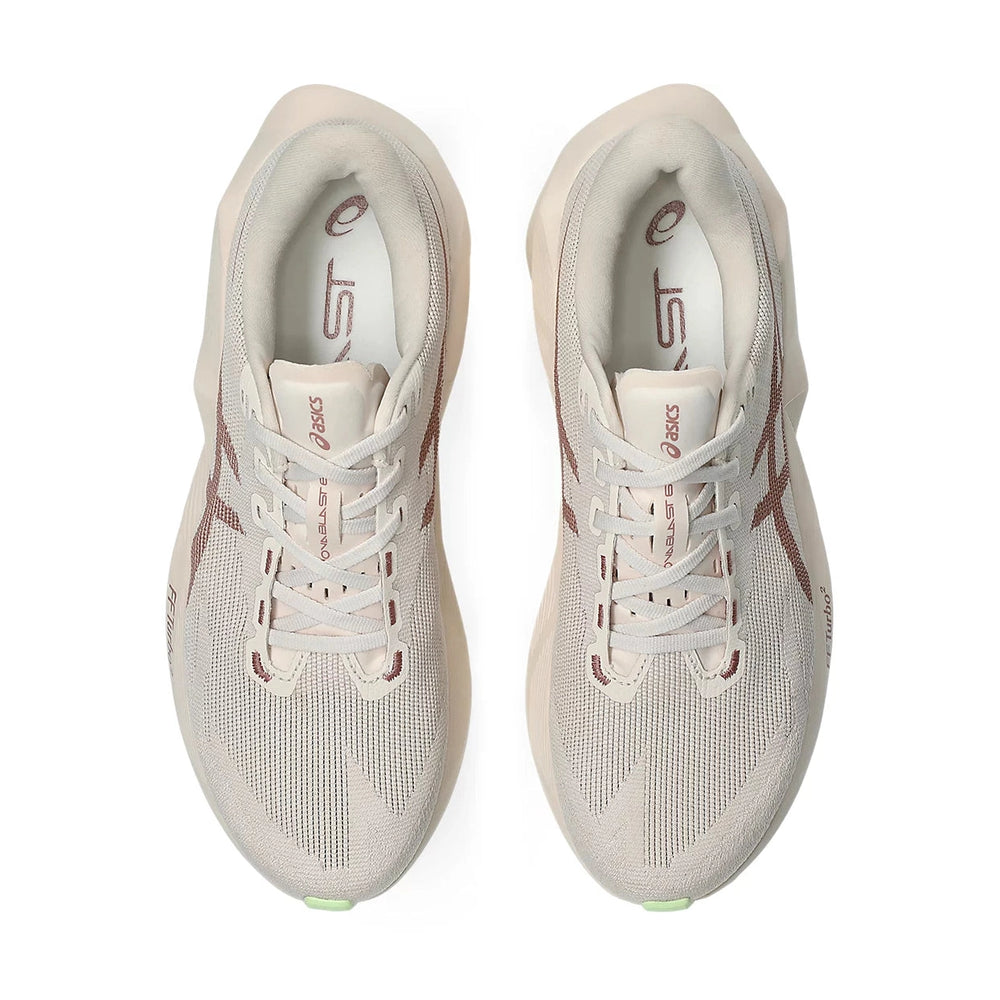 Novablast 6 a men's pair of ASICS running shoes in a light cream/off-white mesh with dusty rose accents on the side stripes and laces, shown from a top-down view on a white background.