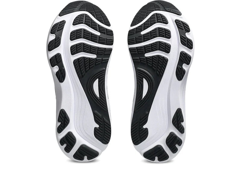 A pair of Gel-Kayano 32 athletic shoes shown from the sole view, featuring a white and black textured tread pattern on a clean white background.