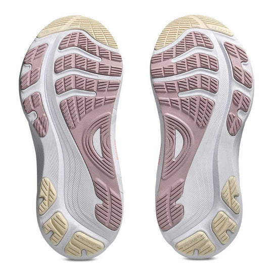 A pair of Gel-Kayano 32 athletic shoes shown from the sole side, featuring a white midsole with dusty pink and beige outsole tread patterns.