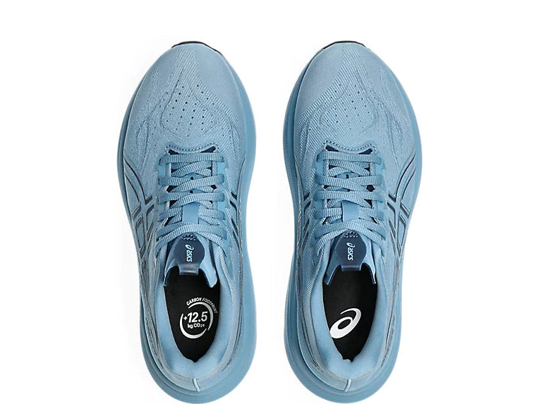 Pair of light blue Asics 2000 v14 running shoes with a white background