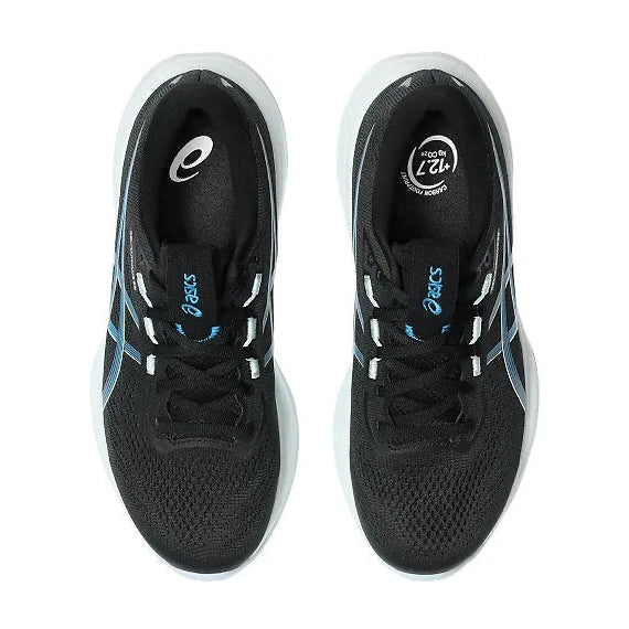 A pair of ASICS Cumulus running shoes in black with light blue stripes and white soles, shown from a top-down view on a white background.