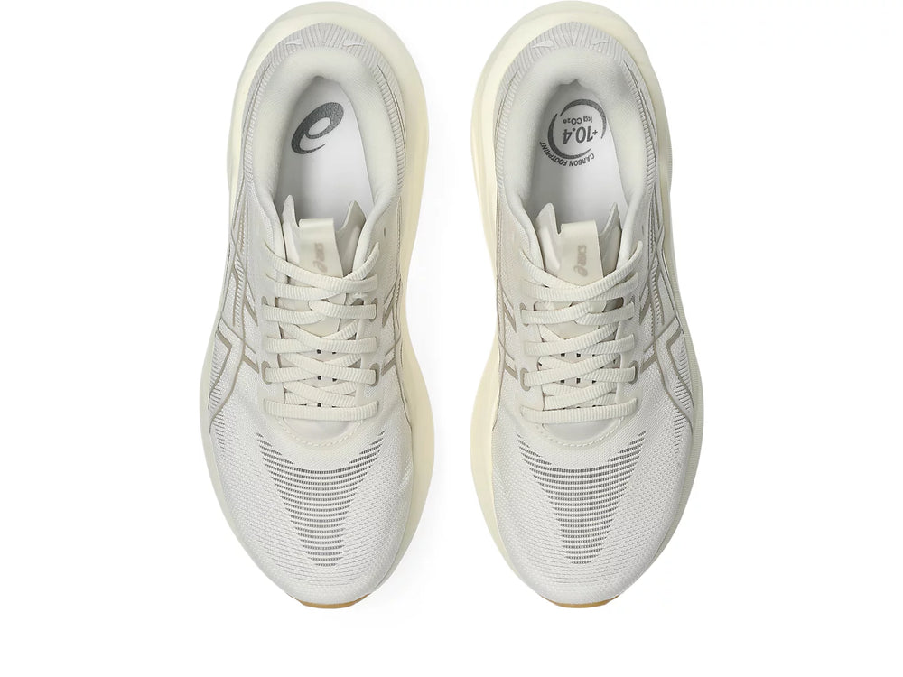 A pair of Asics GT-2000 15 running shoes in a light cream/off-white color, shown from a top-down view on a solid white background.