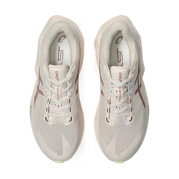 Novablast 6 a women's pair of ASICS running shoes in a light beige and off-white colorway, featuring dusty rose accents on the side stripes and tongue, photographed from a top-down angle on a white background.