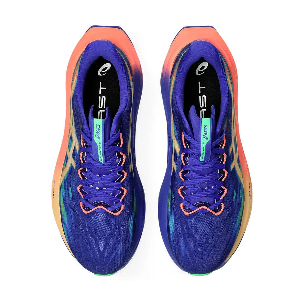 A pair of ASICS Superblast running shoes in a vibrant blue-purple colorway with orange, teal, and yellow accents, shown from a top-down view on a white background.