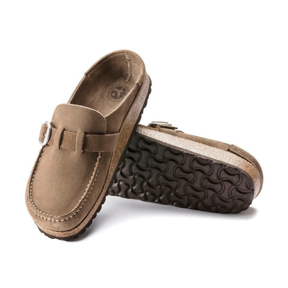 Pair of brown BIRKENSTOCK Buckley loafers with a buckle on a white background