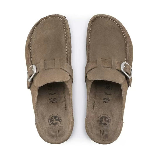 Pair of brown suede BIRKENSTOCK Buckley shoes with buckles on a white background