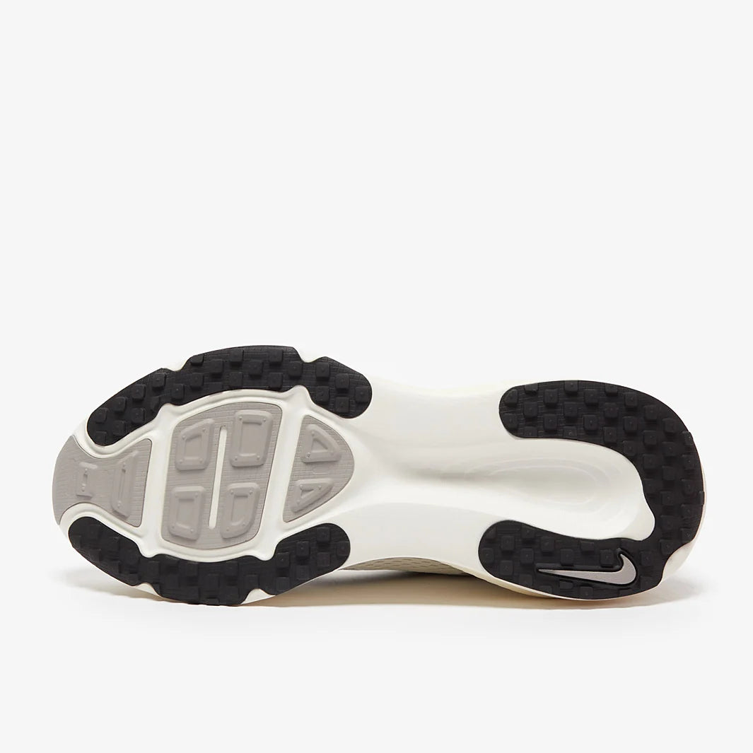 Close-up of a shoe sole with a visible brand logo on a white background