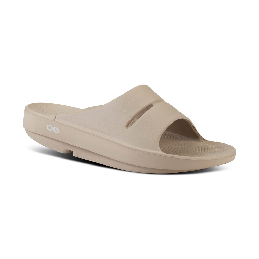 Beige OOfos OOahh sandal on a white background