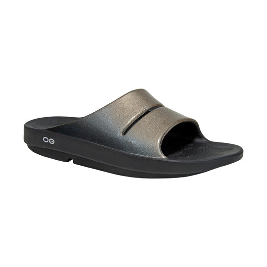 Metallic OOfos OOahh Luxe slide sandal on a white background