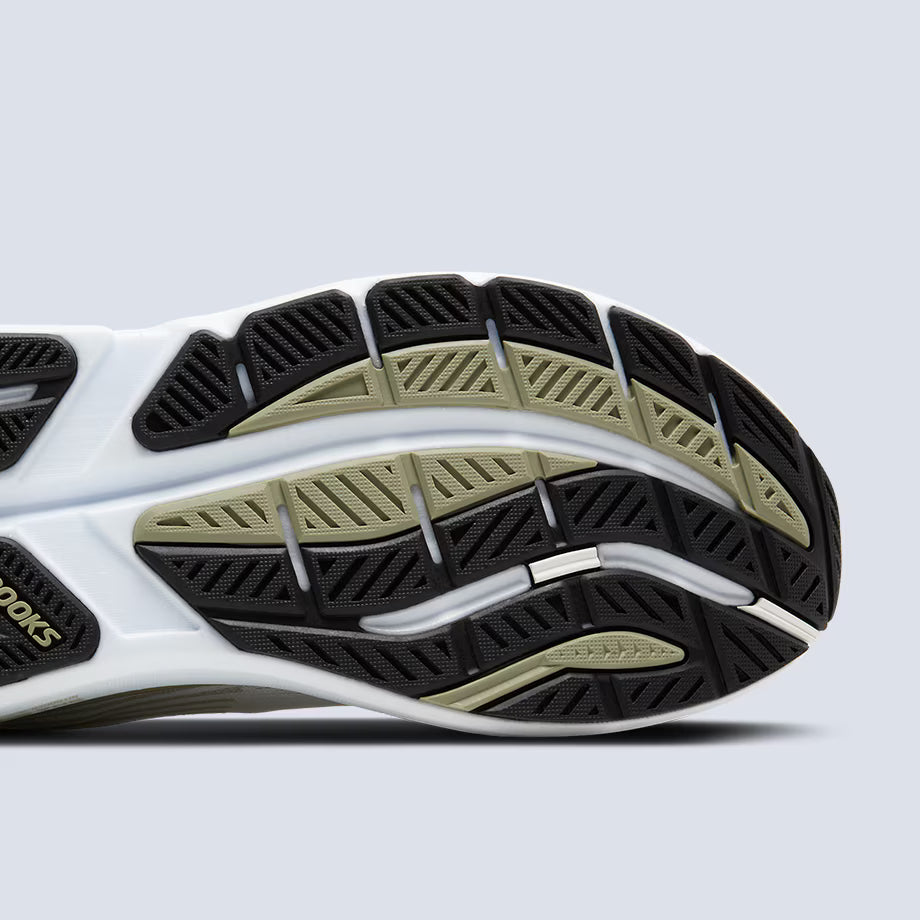 Close-up of a Brooks Mens Ghost Max 3 running shoe sole with white, black, and beige pattern on a light gray background