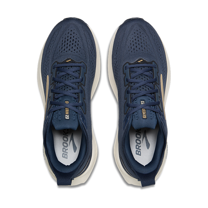 A pair of Brooks Glycerin 23 – Men's running shoes in navy blue with gold and white accents, shown from a top-down view on a solid white background.