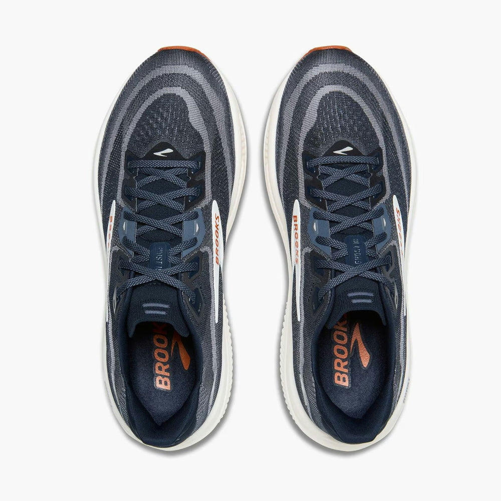 A pair of Brooks Ghost 18 – Men's running shoes shown from a top-down view, featuring a dark navy and gray knit upper with white midsoles and orange accents.