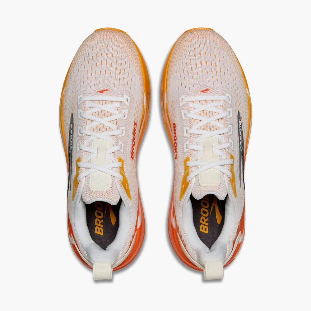 A pair of Brooks Ghost Max 4 mens running shoes shown from a top-down view, featuring a white mesh upper with orange accents, white laces, and a white and orange midsole on a light gray background.