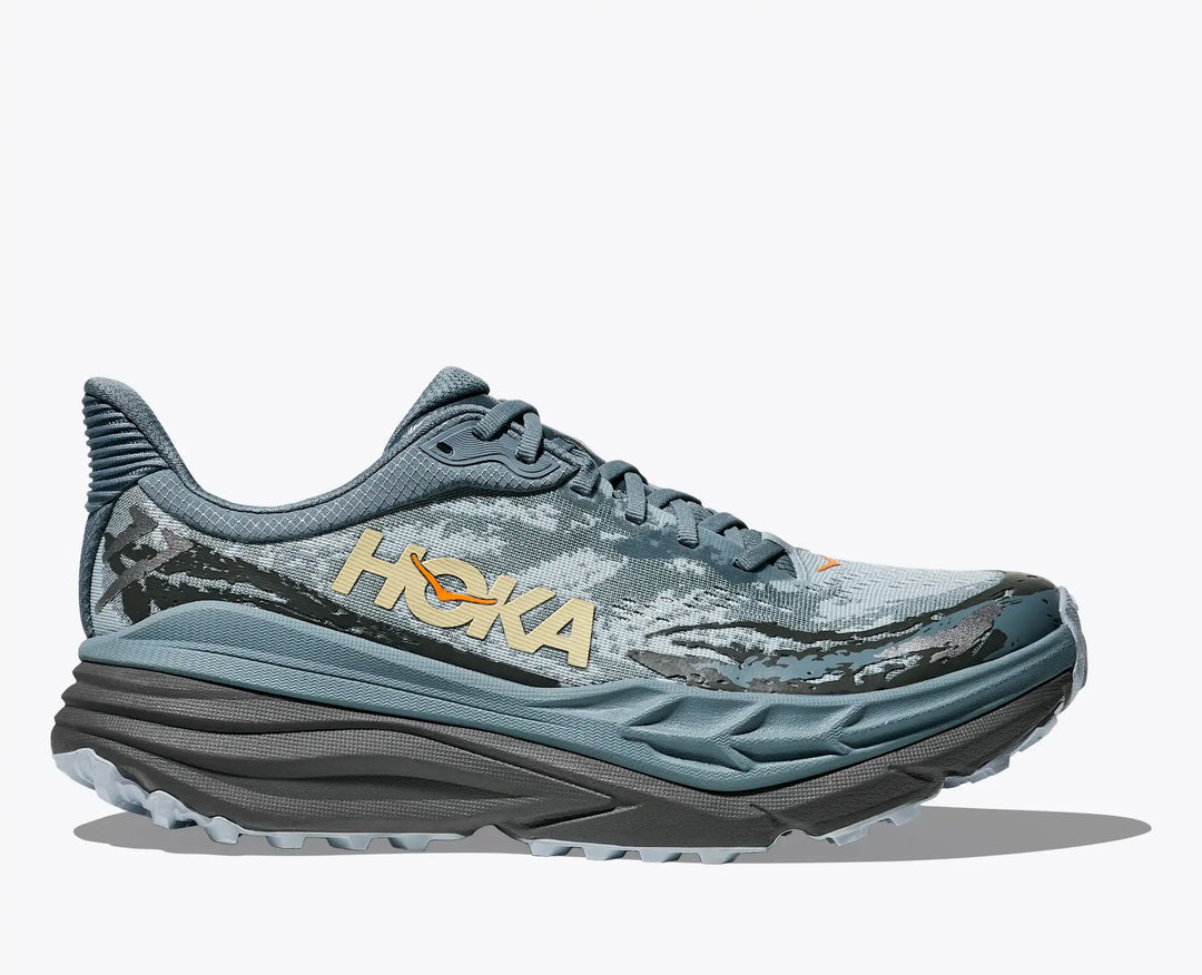 Blue Hoka Stinson 7 – Men's running shoe with 'Hoka' branding on a white background