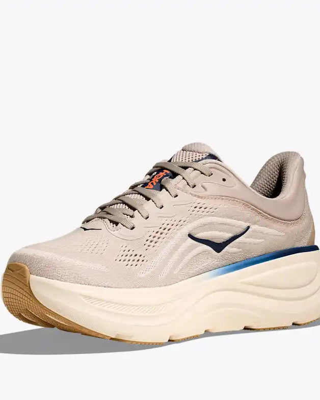 hoka bondi 9 Beige running shoe with a white sole on a light gray background
