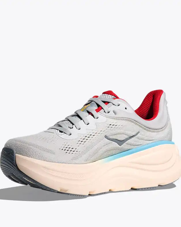 Gray running shoe with red accents on a white background