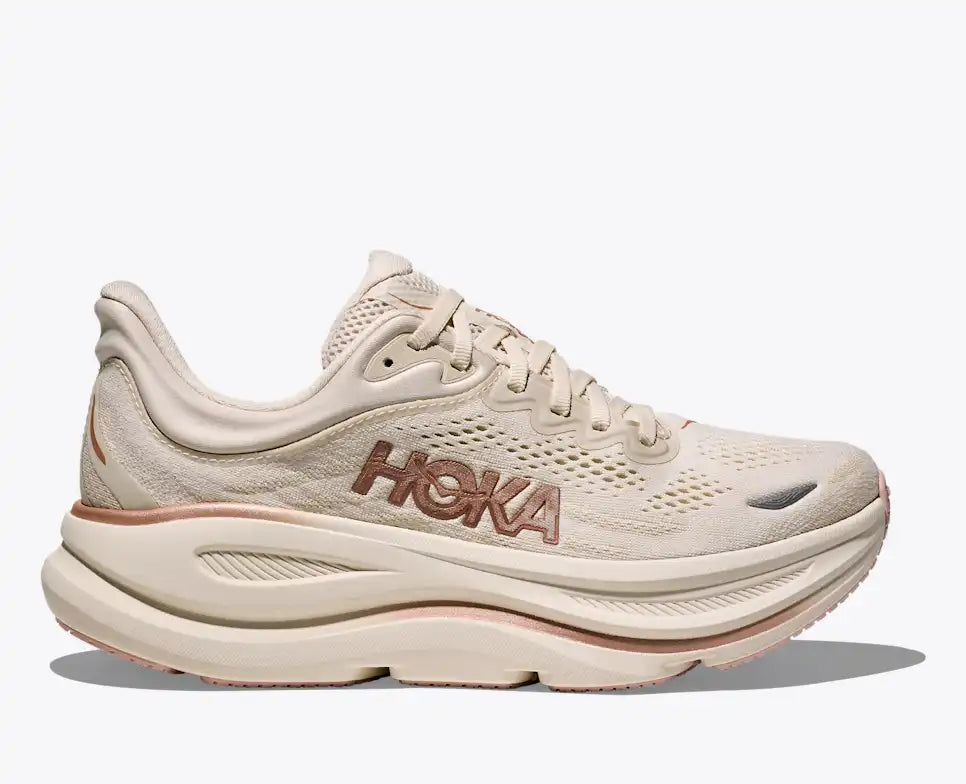Beige running shoe with 'Hoka' branding on a white background