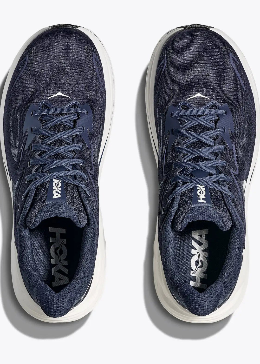 Navy Hoka Men's Clifton 10 running shoes with white soles on a light gray background