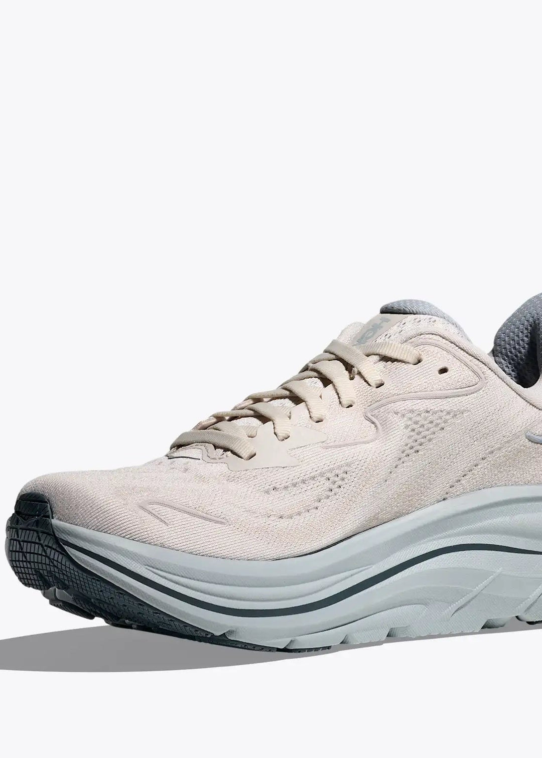 Hoka Womens's Clifton 10 White  running shoe with a white sole on a light gray background