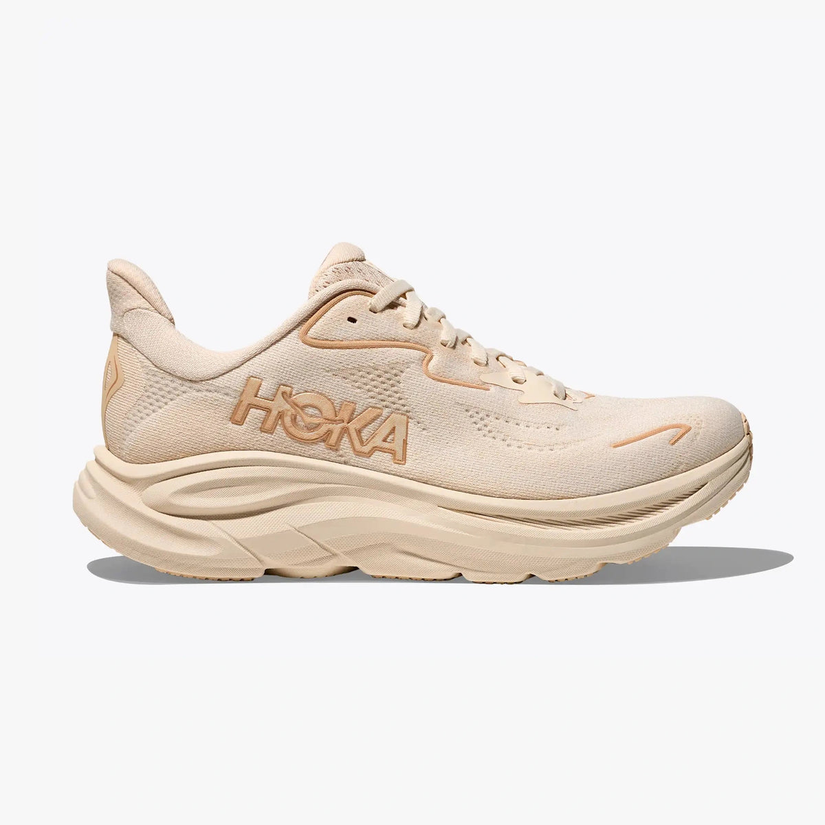 A single Hoka Clifton 10 – Women's running shoe in a light beige and cream colorway, shown from the side profile against a clean white background.