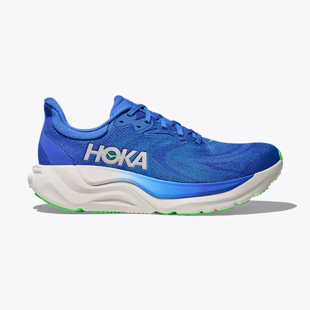 A Hoka Arahi 8 – Men's running shoe in vibrant blue and white with a bright green outsole accent, shown from a side profile on a light gray background.