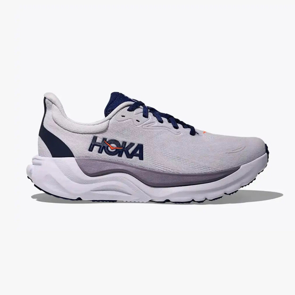 A Hoka Arahi 8 – Women's running shoe in light gray and white with navy blue accents, shown from the side profile against a light gray background.