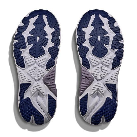 Close-up of the sole of a running shoe with blue and white design on a white background