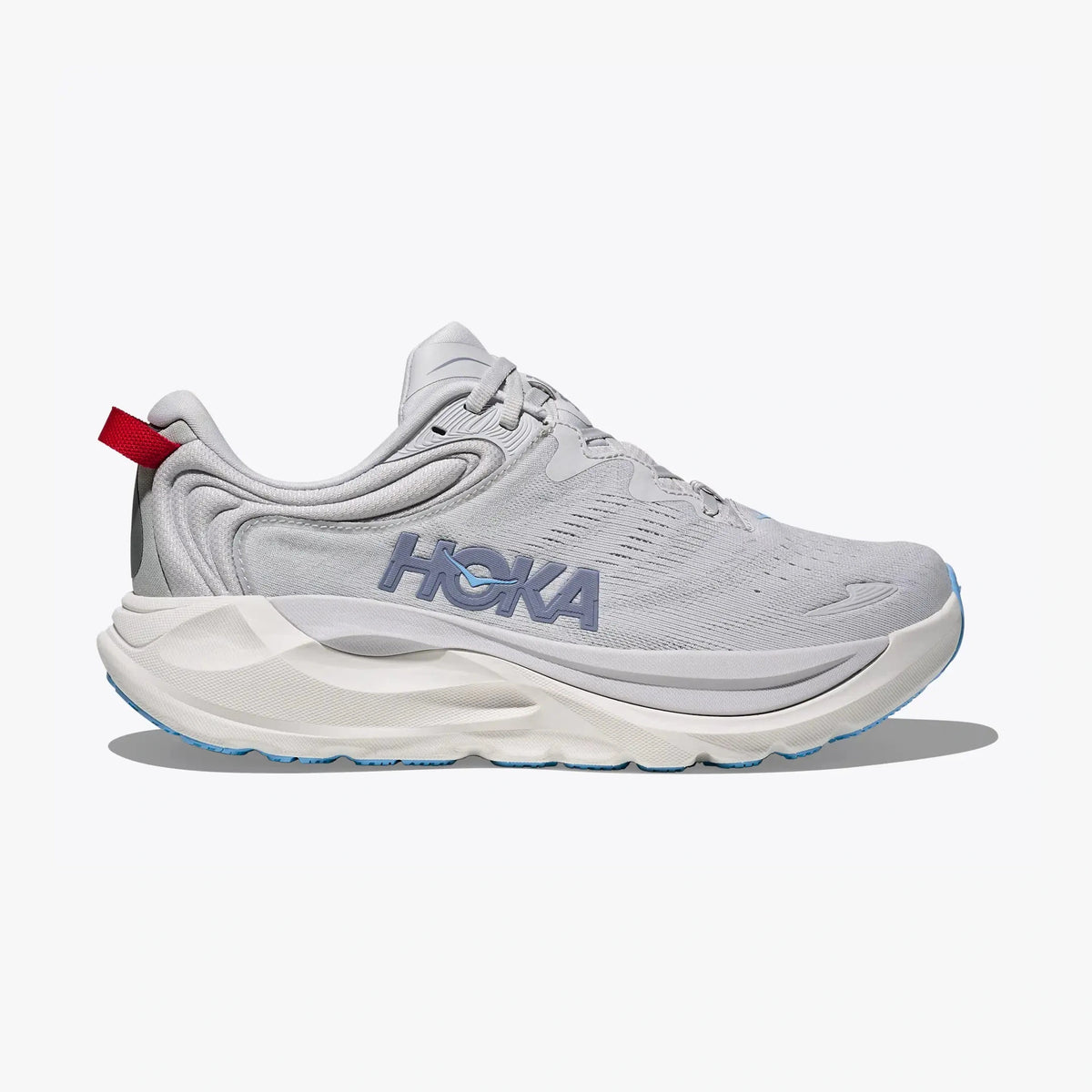A light gray Hoka Gaviota 6 – Women's running shoe with a white midsole, featuring a gray HOKA logo on the side, a small red pull tab, and light blue accents on the outsole, shown against a light gray background.