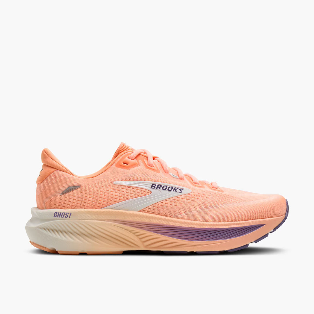 Peach-colored running shoe with 'Brooks' branding on a white background
