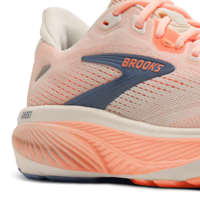 Coral and beige Brooks Ghost 18 running shoe with Brooks logo on a white background