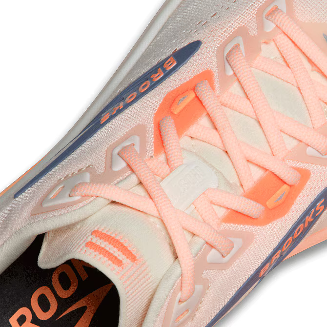 Close-up of a  Brooks Ghost 18 running shoe with pink laces and 'Brooks' branding.