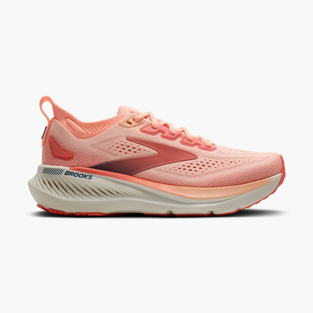 Brooks Glycerin Gts 23 – Women's running shoe in a coral pink and peach colorway with a thick white and coral midsole, shown from the side on a light gray background.