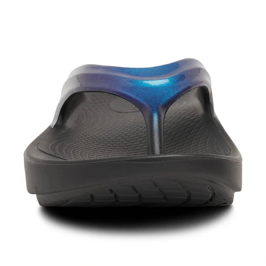 Black Oofos OOLALA sandal with blue metallic heel on a white background