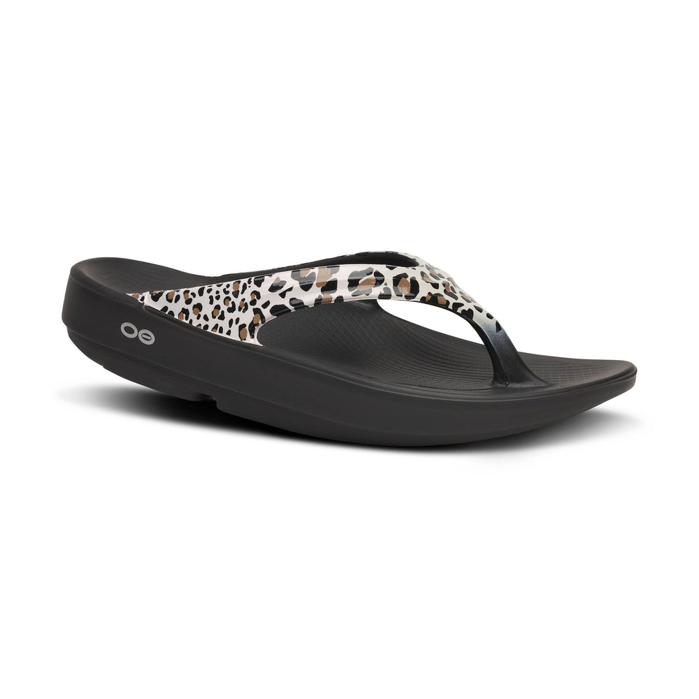 Black OOfos OOlala Limited sandal with leopard print toe strap on a white background