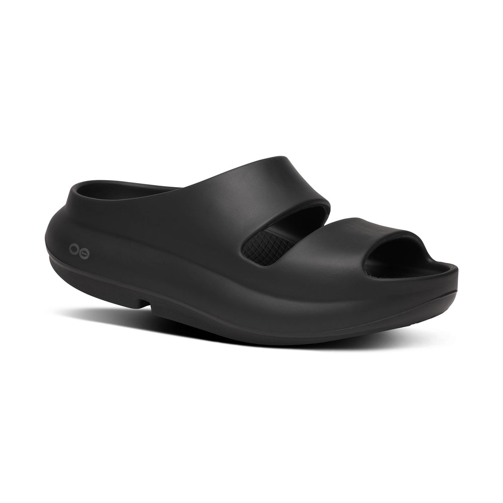 Black OOfos OOyea sandal with open toe design on a white background