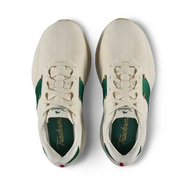 A pair of Tracksmith Eliot Ryder – All Gender sneakers shown from a top-down view, featuring an off-white mesh upper with green side panels and green lining, on a white background.