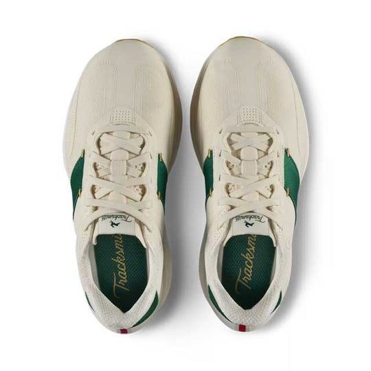 A pair of Tracksmith Eliot Ryder – All Gender sneakers shown from a top-down view, featuring an off-white mesh upper with green side panels and green lining, on a white background.