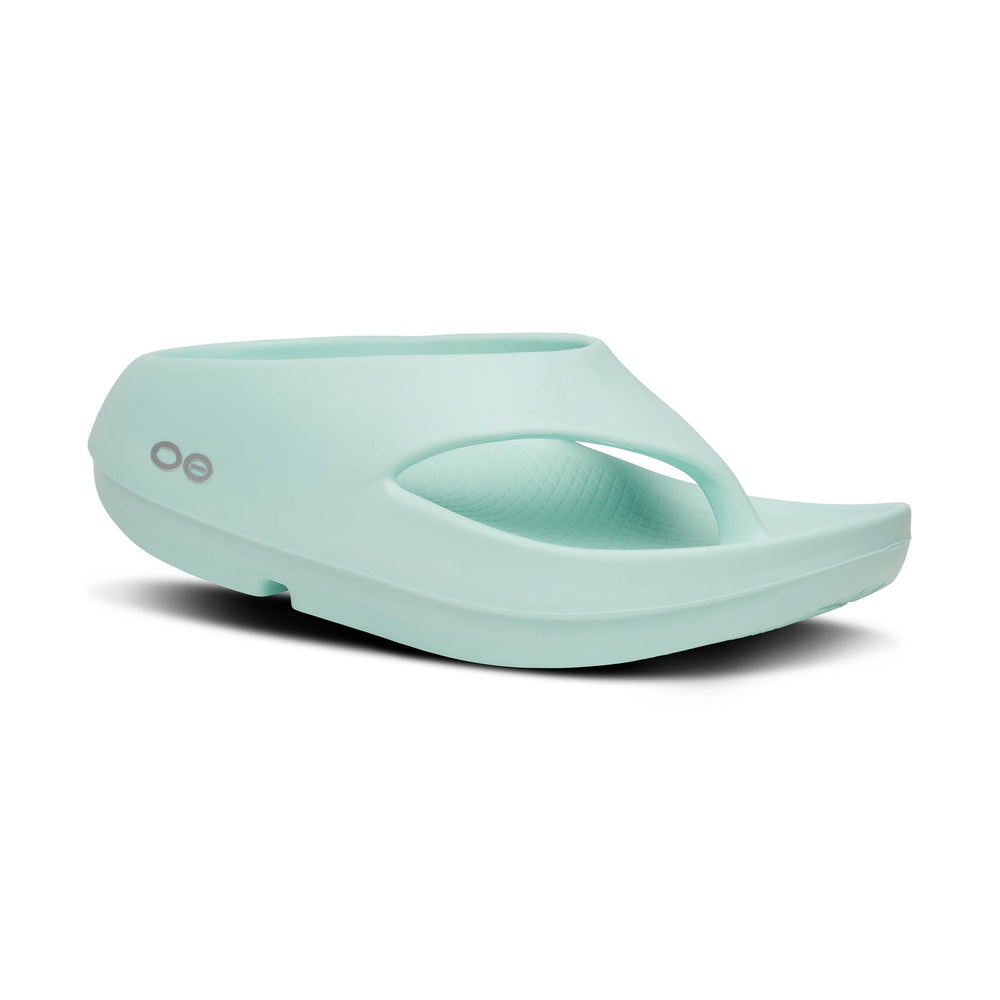 Mint green OOfos OOriginal PLUS sandal on a white background