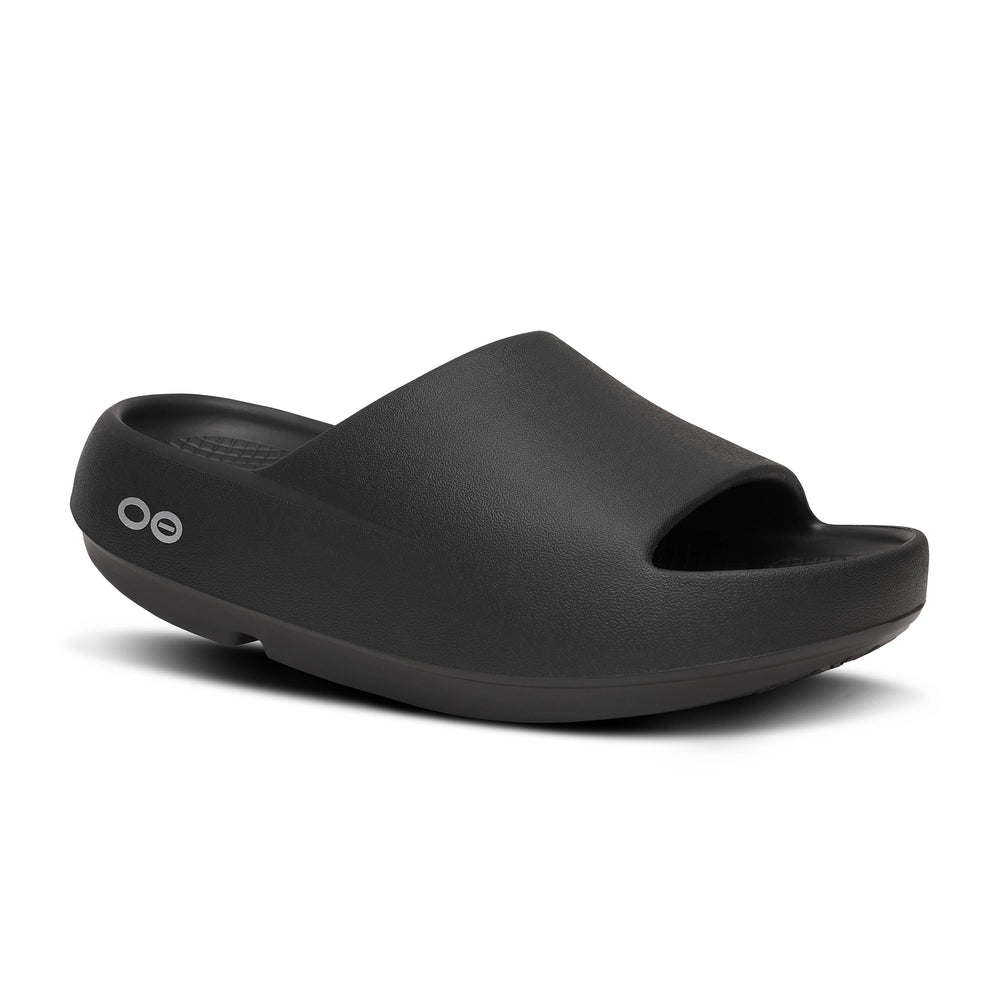 Black OOfos OOah PLUS sandal on a white background