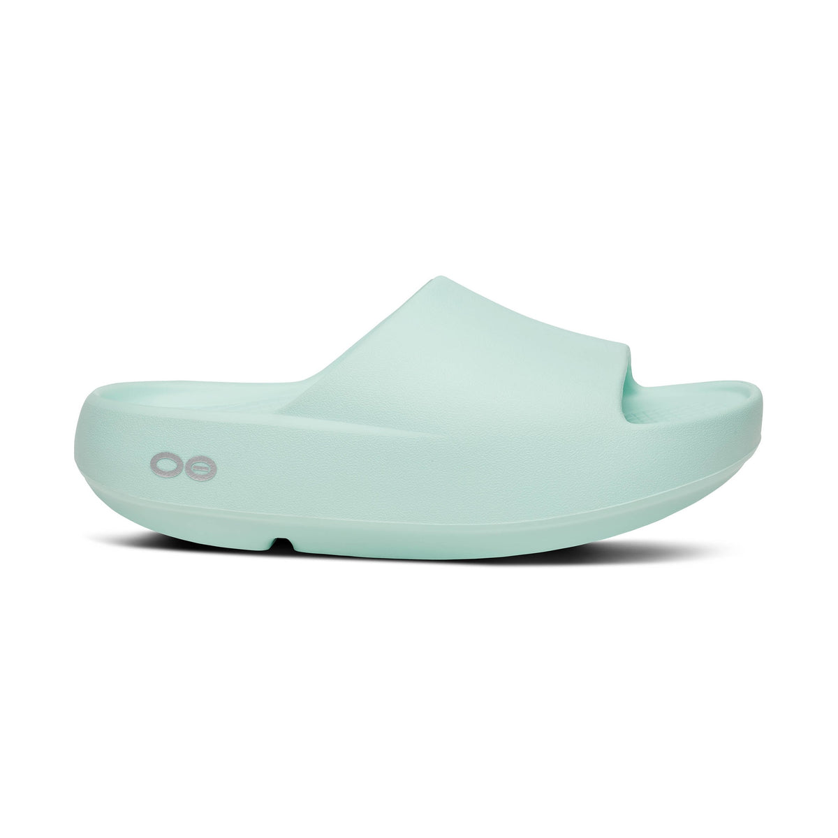 Oofos Oohaah Plus Mint green slide sandal on a white background Her
