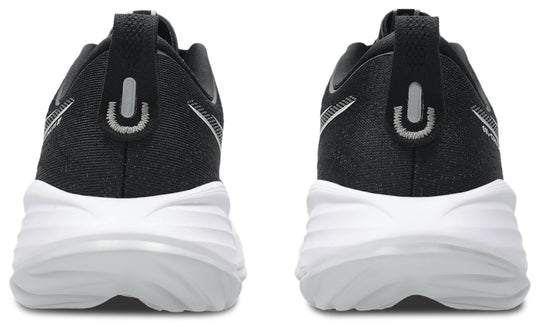 Black and white Gel Cumulus 27 athletic sneakers shown from the rear, featuring a textured black upper, a white chunky sole, and a pull tab with a silver U-shaped logo.
