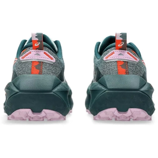 A pair of Trabuco Max 4 trail running shoes shown from the rear, featuring a dark teal and gray mesh upper with bright orange accents and a chunky dark teal midsole and light pink outsole.