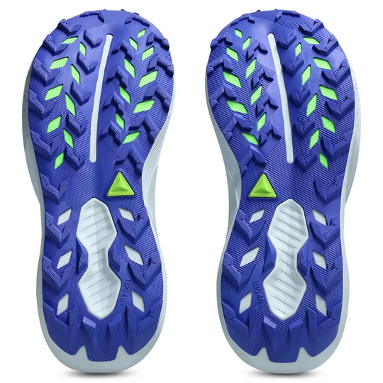 A pair of Trabuco 14 athletic shoes shown from the bottom, featuring a textured blue and white outsole with bright green accents and tread patterns, set against a plain white background.