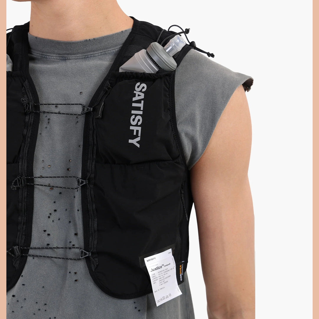 Person wearing a black Justice Cordura 5L Hydration Vest with &