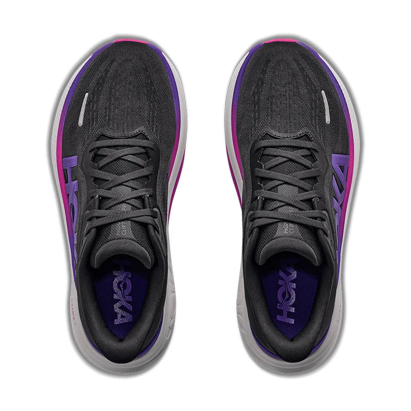 A pair of Clifton Pro – Women's running shoes shown from a top-down view, featuring a dark gray knit upper with purple and magenta accents, a white midsole, and a purple HOKA logo on the insole.