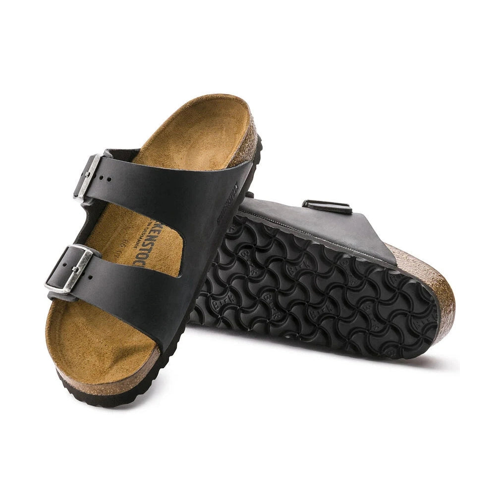 Black BIRKENSTOCK Arizona sandal with cork lining on a white background
